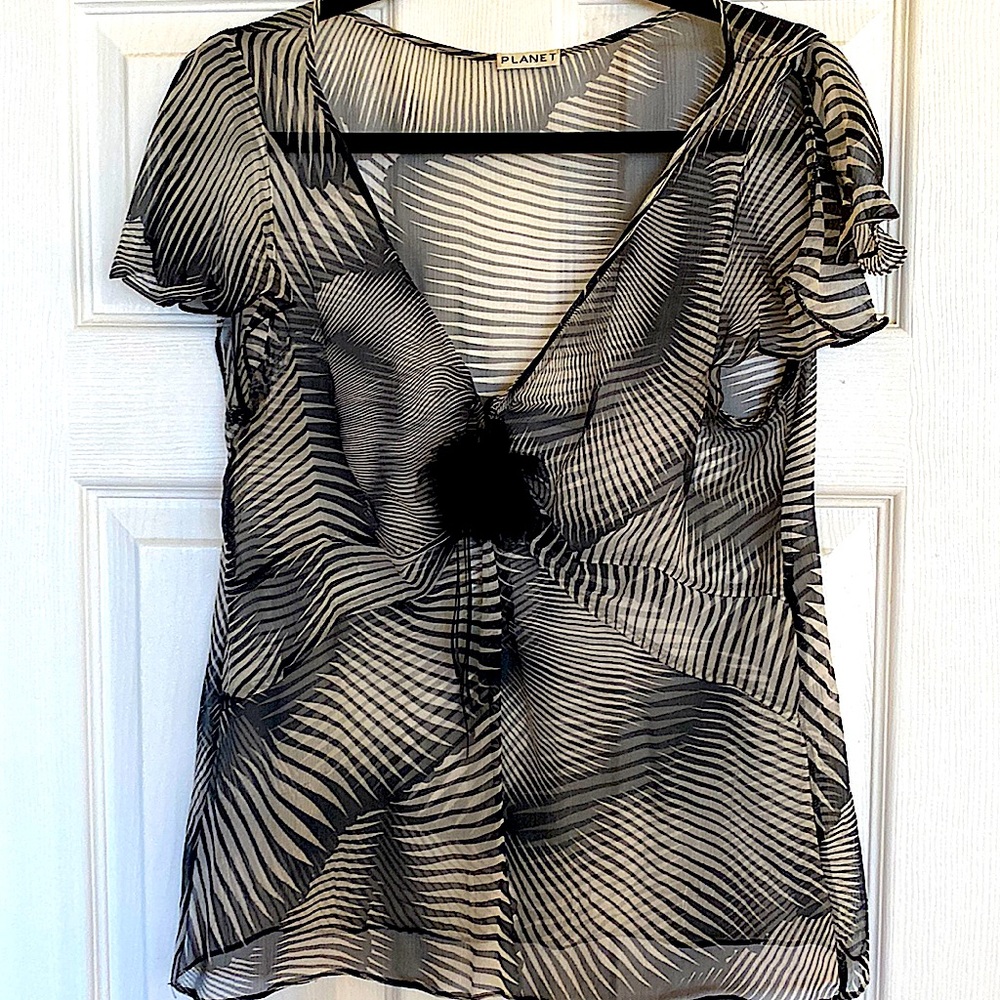 Beautiful sheer Zebra dress blouse with flower detail at v neck
